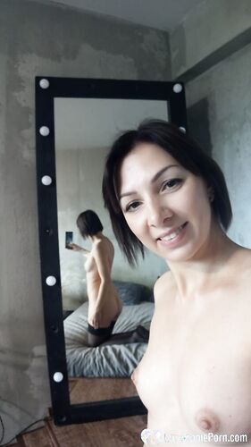 Office worker taking some nudes at home