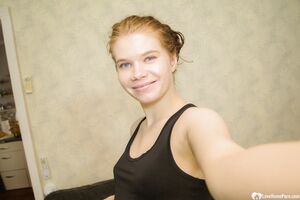 Pregnant amateur girl shows off her belly