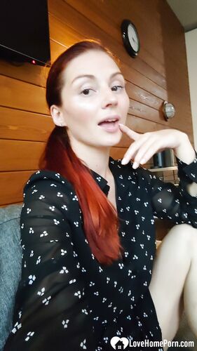 Naughty redhead reveals her big tits on cam