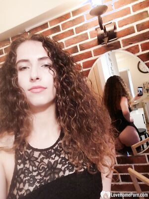 Cutie with curly brunette hair shows her tits