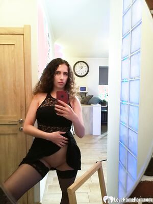 Cutie with curly brunette hair shows her tits