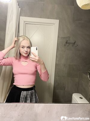 Tattooed blonde showing off her sexy tattoos