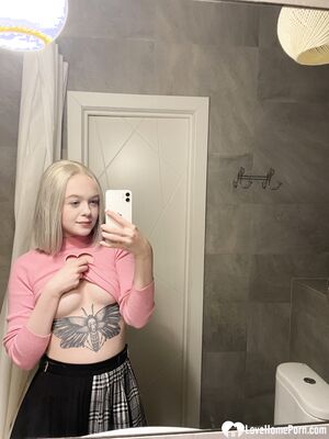 Tattooed blonde showing off her sexy tattoos