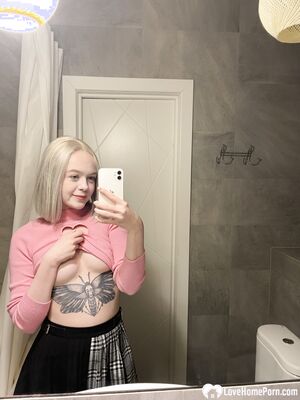 Tattooed blonde showing off her sexy tattoos