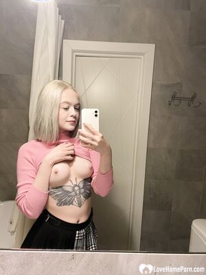 Tattooed blonde showing off her sexy tattoos
