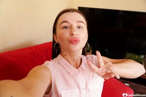 Cute brunette shows off her petite curves