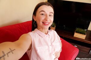 Cute brunette shows off her petite curves