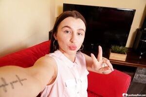 Cute brunette shows off her petite curves