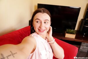 Cute brunette shows off her petite curves