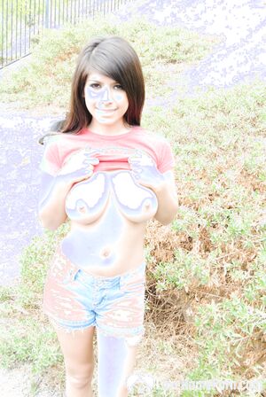 Seductive teen takes off her clothes outside