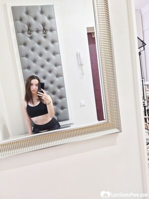 Cutie shows her stockings while posing passionately