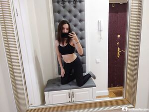 Cutie shows her stockings while posing passionately