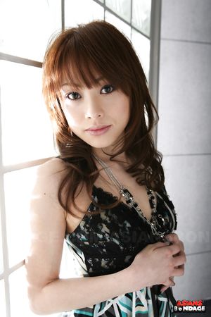 Brunette Japanese porn star Miina Yoshiwara looks so sexy in her dress