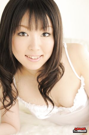 Smiling brunette chick in white Aoi Minami showing off her body