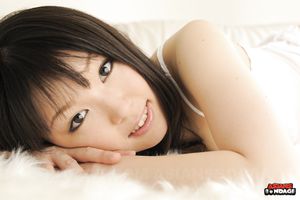 Smiling brunette chick in white Aoi Minami showing off her body