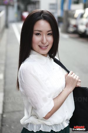 Petite Japanese porn starlet Anna Sakura posing in her green skirt