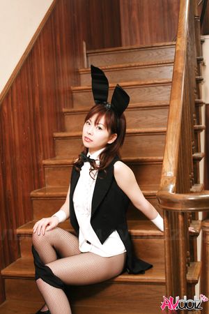 Nasty Ran Monbu bunny shows big boobs and trimmed pussy on stairs.