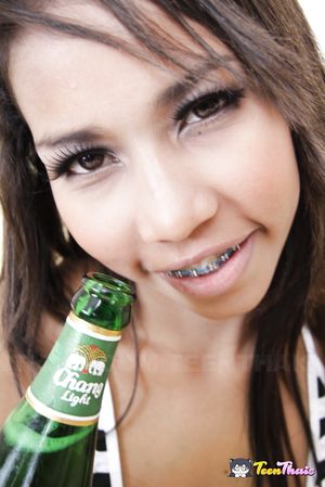 Petite and tanned Thai teen called Sofie has her shaved hole fucked