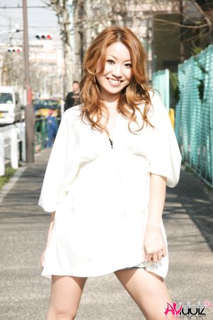 Momomi Sawajiri in boots, blouse and shorts is very playful outdoors.