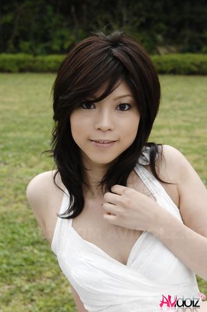 Asian Kurumi Katase in white dress is playful and happy in the nature.