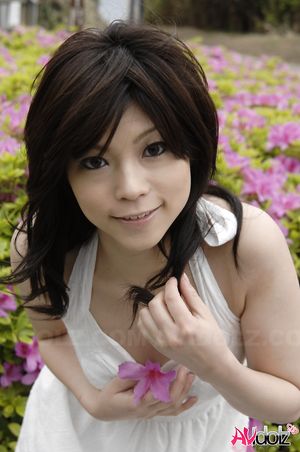 Asian Kurumi Katase in white dress is playful and happy in the nature.