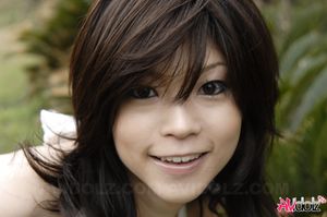 Asian Kurumi Katase in white dress is playful and happy in the nature.