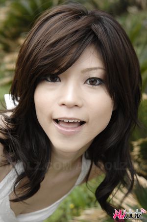 Asian Kurumi Katase in white dress is playful and happy in the nature.