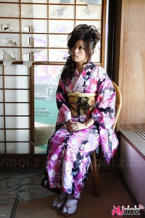 Asian Chiaki fucks her hairy pussy with toys under colorful kimono.