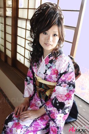 Chiaki in kimono spreads legs and shows hairy pussy on the floor.