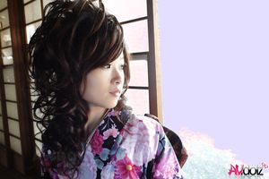 Chiaki in kimono spreads legs and shows hairy pussy on the floor.