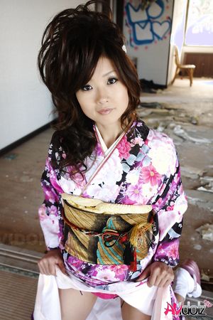 Chiaki in kimono spreads legs and shows hairy pussy on the floor.