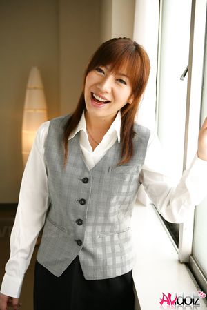 Asian Aki Yatou in uniform smiles a lot during this photo session.