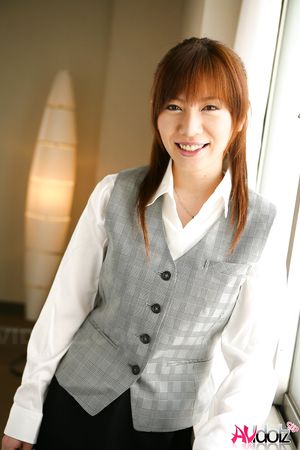 Asian Aki Yatou in uniform smiles a lot during this photo session.