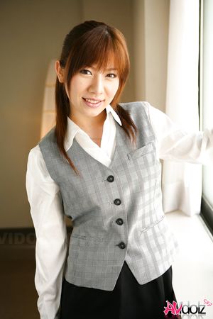 Asian Aki Yatou in uniform smiles a lot during this photo session.