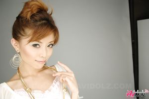 Hot Akane Hotaru in white blouse, shorts and high heels loves posing.