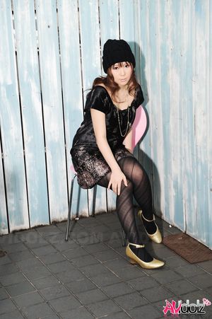 Yuko Morita looks so cool in black dress and tights in these photos.
