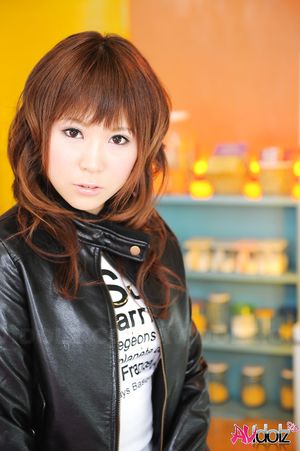 Asian Yuko Morita is so fashionable in short skirt and blue tights.