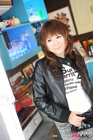 Asian Yuko Morita is so fashionable in short skirt and blue tights.