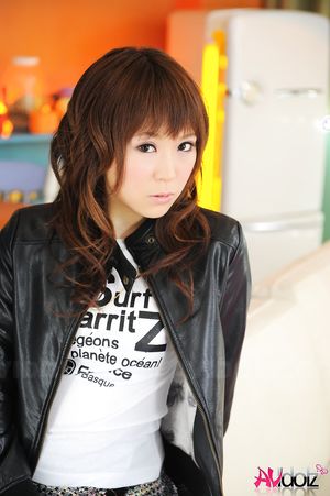 Asian Yuko Morita is so fashionable in short skirt and blue tights.