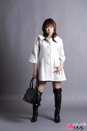 Asian Yuko Morita in long boots and white coat is simply gorgeous.