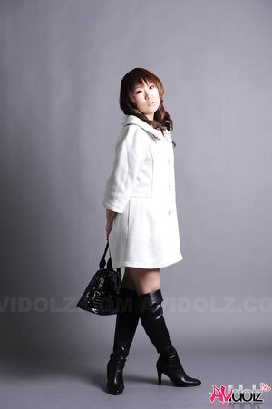Asian Yuko Morita in long boots and white coat is simply gorgeous.