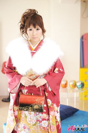 Asian Yuko Morita looks fantastic in a kimono and with a fur collar.