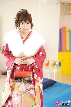 Asian Yuko Morita looks fantastic in a kimono and with a fur collar.