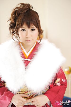 Asian Yuko Morita looks fantastic in a kimono and with a fur collar.