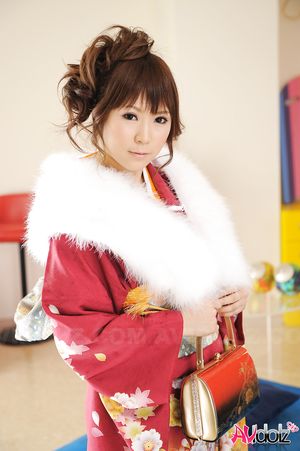 Asian Yuko Morita looks fantastic in a kimono and with a fur collar.
