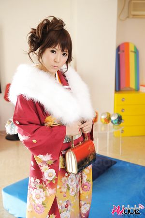 Asian Yuko Morita looks fantastic in a kimono and with a fur collar.