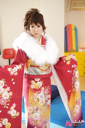 Asian Yuko Morita looks fantastic in a kimono and with a fur collar.