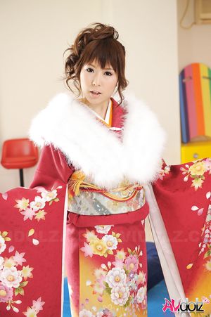 Asian Yuko Morita looks fantastic in a kimono and with a fur collar.