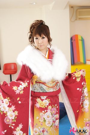 Asian Yuko Morita looks fantastic in a kimono and with a fur collar.
