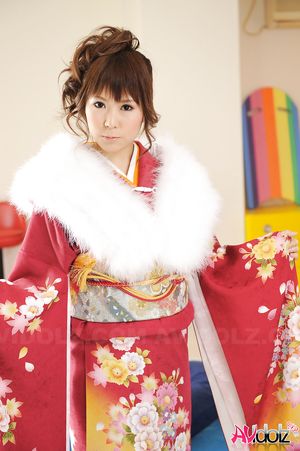 Asian Yuko Morita looks fantastic in a kimono and with a fur collar.